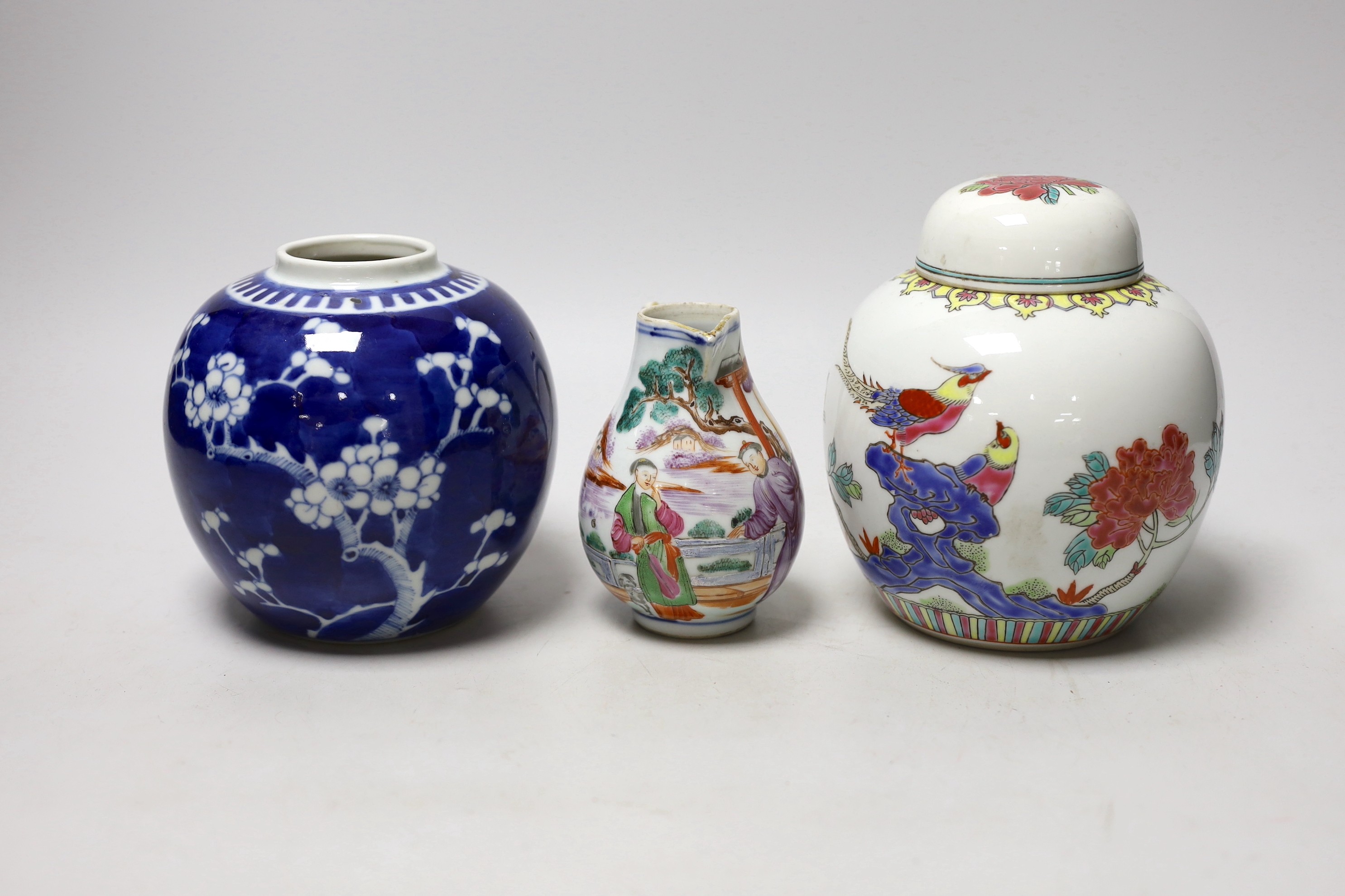 A Chinese famille rose Mandarin sparrow beak jug, Qianlong period, 10.5cm high and two 20th Centry porcelain jars